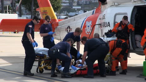 Coast-Guard-Helicopter-Lands-At-Landing-Site-And-Injured-People-Are-Taken-By-Paramedics-To-Hospital-6