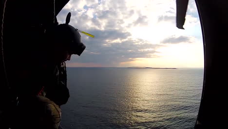 Pov-Of-Marines-Flying-In-A-Helicopter-Over-The-Ocean