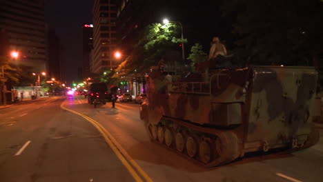 Police-And-Marines-Roll-Out-Tanks-And-Armored-Vehicles-Through-An-American-City-During-Times-Of-Public-Unrest-And-Rioting-1