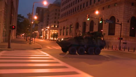 Police-And-Marines-Roll-Out-Tanks-And-Armored-Vehicles-Through-An-American-City-During-Times-Of-Public-Unrest-And-Rioting-4