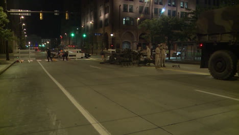 Police-And-Marines-Roll-Out-Tanks-And-Armored-Vehicles-Through-An-American-City-During-Times-Of-Public-Unrest-And-Rioting-13