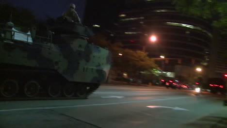 Police-And-Marines-Roll-Out-Tanks-And-Armored-Vehicles-Through-An-American-City-During-Times-Of-Public-Unrest-And-Rioting-16
