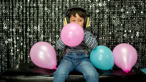 Young-Boy-Playing-With-Balloons-16