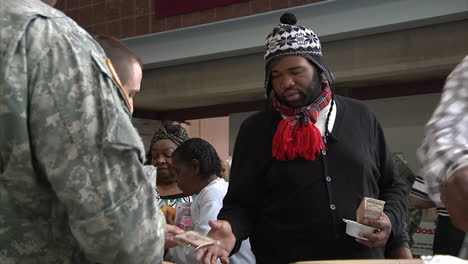 New-Jersey-National-Guard-Troops-Hand-Out-Food-To-Survivors-Of-Hurricane-Sandy-At-A-Refugee-Center