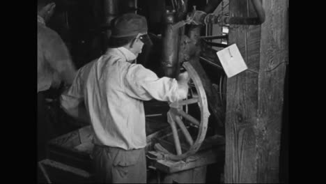 Workers-In-An-Automobile-Factory-Make-The-Spokes-For-Wheels-On-A-Model-T-In-1915