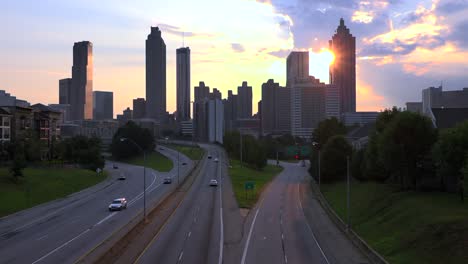 Silhouetted-view-of-skyscrapers-and-high-rises-behind-Atlanta-Georgia-at-sunset-2