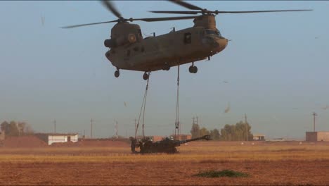 A-Helicopter-Drops-Off-Artillery-Equipment-To-American-Soldiers-Stationed-In-Punjiha-Iraq