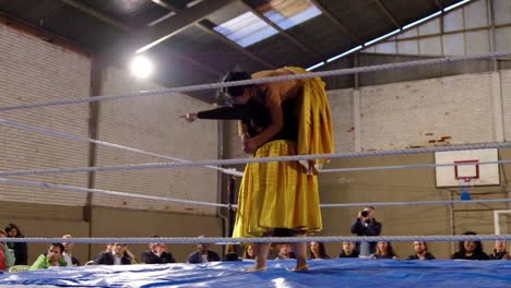 Female-Woman-Cholita-Wrestlers-In-Native-Costume-Fight-In-A-Boxing-Ring-In-Bolivia