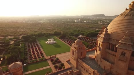 An-vista-aérea-view-shows-birds-flying-over-the-Umaid-Bhawan-Palace-in-Jodhpur-India-1