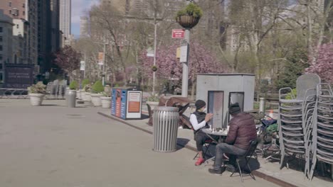 POV-slow-mo-shot-of-social-distancing-and-mask-wearing-chess-playing-New-York-Manhattan-during-the-Covid19-coronavirus-epidemic-outbreak