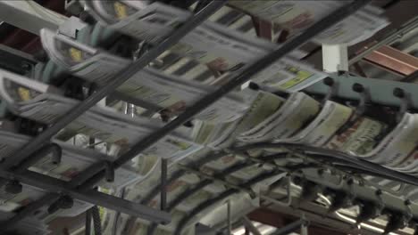 Newspapers-flow-along-an-assembly-line-in-a-newspaper-factory-3