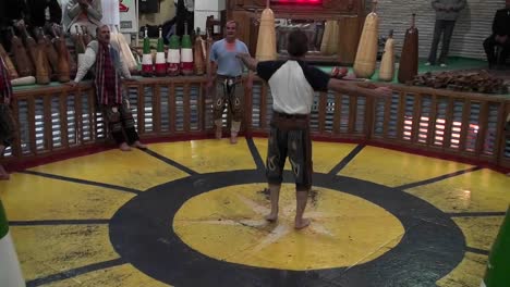 A-man-spinning-in-a-circle-demonstrates-the-traditional-Iranian-martial-art-of-Pahlavani-1