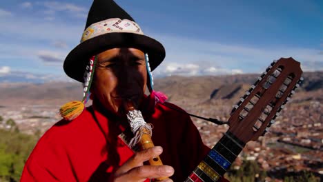 Traditional-musician--Cusco-in-background
