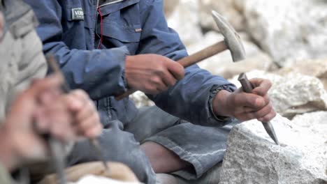 Stonemasons-chiseling-away-rock