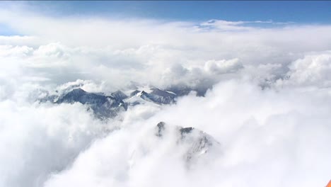 Looking-down-through-clouds-to-Tibet