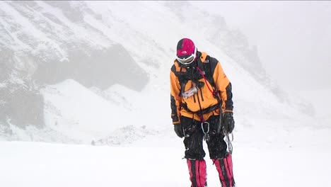 Climber-approaching-through-falling-snow