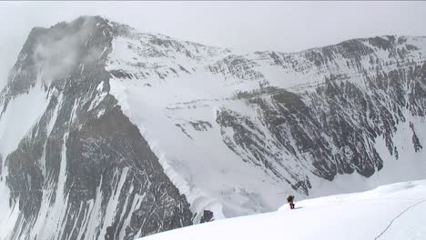 Climber-ascending-north-side-up-snow-slope