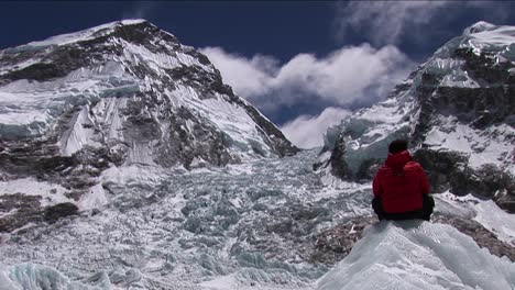 Climber-sitting-looking-out-at-Khumbu-icefall