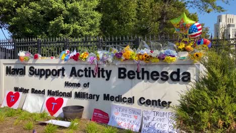 Flowers-And-Balloons-Are-Left-By-Supporters-Of-President-Donald-Trump-Rally-Outside-Walter-Reed-Hospital-When-He-Is-Hospitalized-For-Covid19-Coronavirus-Pandemic