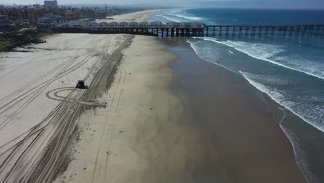 Aerial-of-lifeguard-ranger-vehicle-and-abandoned-beaches-of-Ventura-southern-california-during-covid19