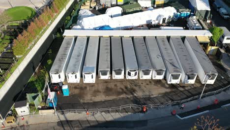 An-aerial-view-over-temporary-morgue-refrigeration-trailers-containing-the-bodies-of-victims-of-the-coronavirus-pandemic-1