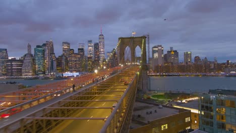 Magnificent-beautiful-dramatic-aerial-of-the-Brooklyn-Bridge-at-night-in-New-York-City-1