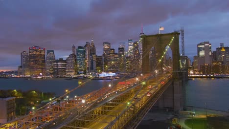 Magnificent-beautiful-dramatic-aerial-of-the-Brooklyn-Bridge-at-night-in-New-York-City-2
