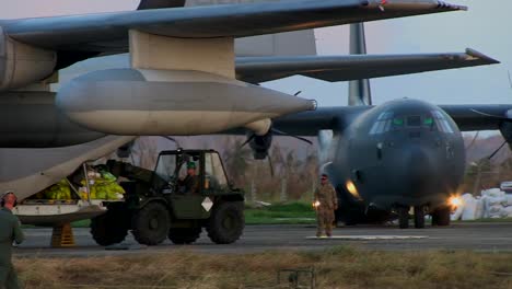 Emergency-Relief-Supplies-Are-Delivered-From-A-Kc130-Super-Hercules-Aircraft-To-Victims-Of-Typhoon-Haiyan-In-The-Philippines