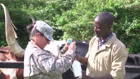 Africans-In-A-Village-In-Uganda-Are-Helped-By-Members-Of-The-Us-Military-To-Understand-How-Animals-Can-Be-A-Source-For-Disease-1