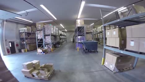 High-Speed-Pov-Shot-Traveling-Through-A-Large-Warehouse-Facility