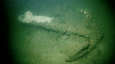 A-Rusting-Anchor-Sits-At-The-Bottom-Of-The-Ocean-Floor