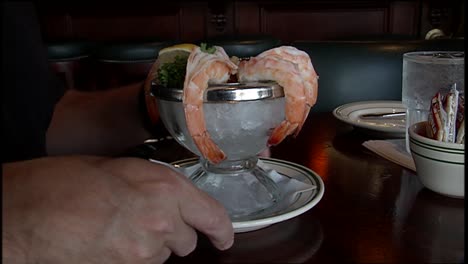 A-Man-Eats-Shrimp-In-A-Restaurant