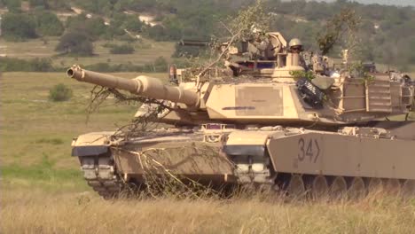 Camouflaged-Tanks-Advance-On-The-Battlefield