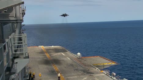 The-Harrier-Jet-Aircraft-Fighter-Lands-On-The-Deck-Of-An-Aircraft-Carrier