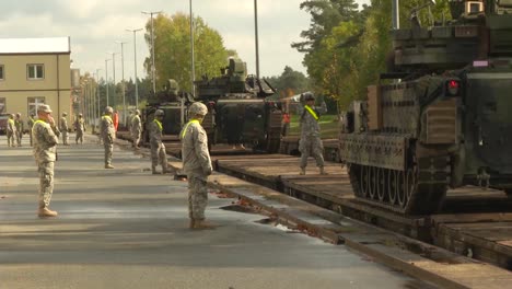 Tanks-Are-Loaded-Onto-A-Train-By-Us-Military-Personnel-In-Germany-1