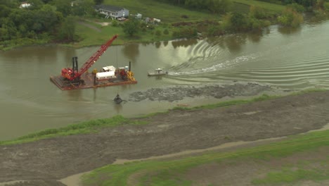 Aerial-Shot-Over-A-Dredging-Operation-On-The-Mississippi-River-In-Flood-Stage