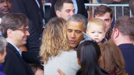 President-Barack-Obama-Is-Warmly-Greeted-By-Members-Of-The-Public-And-Military-1