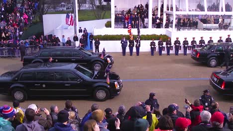 Newly-Appointed-President-Donald-J-Trump-Steps-Out-Of-His-Limousine-And-Greets-Inauguration-Crowds-On-Jan-20-2017