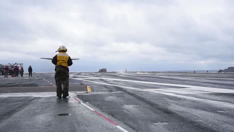 The-Grumann-C2-Greyhound-Lands-On-An-Aircraft-Carrier-1