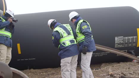 Field-Investigators-From-The-Ntsb-Investigate-An-Oil-Tanker-Train-Wreck-Crash-Near-Graettinger-Iowa-4