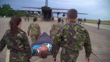 Nato-Troops-Carry-A-Man-With-A-Simulated-Injury-Aboard-A-Plane-As-Part-Of-Exercise-Saber-Guardian