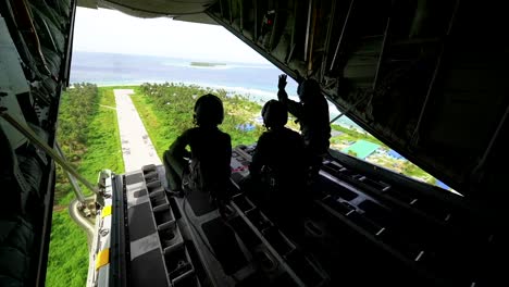 Airmen-Of-The-Japanese-Air-Force-Drop-Supplies-By-Parachute-Over-Islands-As-Part-Of-Operation-Christmas-Drop