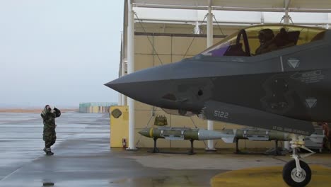 A-Us-Air-Force-F35A-Relámpago-Ii-Is-Guided-Out-Of-A-Hangar-At-The-Kunsan-Air-Base-In-South-Korea