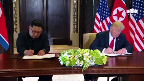 Us-President-Donald-Trump-And-North-Korean-Dictator-Kim-Jong-Un-Sign-A-Document-During-Their-Historic-Singapore-Summit-Meeting-2