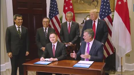 Executives-From-Boeing-And-Singapur-Airlines-Meet-In-The-White-House-To-Sign-A-Deal-For-Aircraft-Under-The-Watchful-Eye-Of-President-Donald-Trump