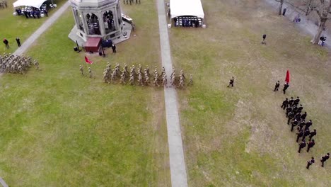 Aerial-Over-Army-Troops-Marching-In-Various-Formations-In-A-Public-Park-2