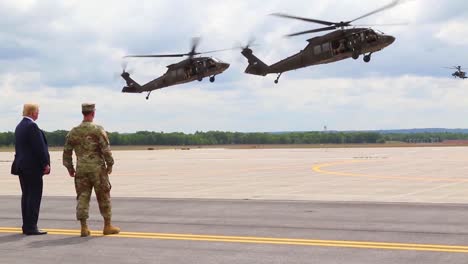 Us-President-Donald-J-Trump-Greets-Commanders-And-Watches-An-Aerial-Display-During-His-Visit-To-Fort-Drum-Ny-To-Sign-The-2019-National-Defense-Authorization-Act-1