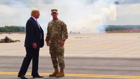 Us-President-Donald-J-Trump-Greets-Commanders-And-Watches-An-Aerial-Display-During-His-Visit-To-Fort-Drum-Ny-To-Sign-The-2019-National-Defense-Authorization-Act-4