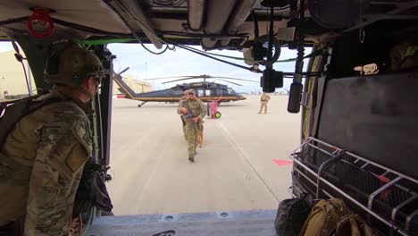 Members-Of-The-Us-Border-Patrol-Walk-With-A-K9-Canine-Dog-To-A-Waiting-Helicopter-1