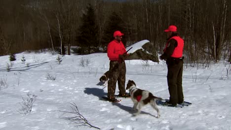 A-Law-Enforcement-Officer-Checks-Hunters'-Licenses-On-A-Wintry-Day-In-A-National-Wildlife-Refuge